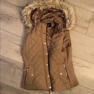 Tan, fur lined hooded, vest.